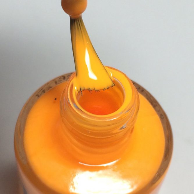 Carnival bottle macro - bright neon orange gloss top coat