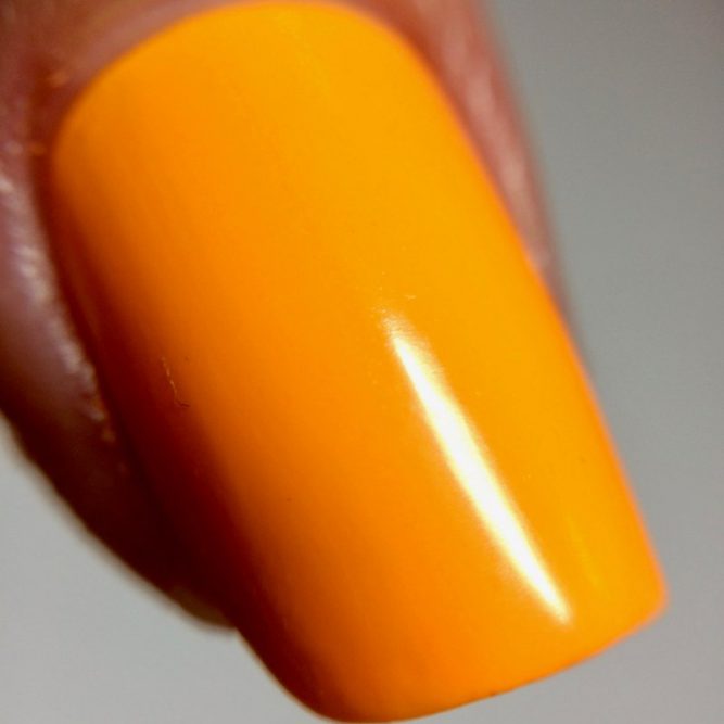 Carnival nail macro - bright neon orange gloss top coat