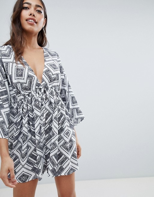 ASOS DESIGN smock playsuit with tie waist in tile print