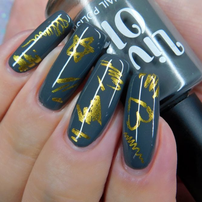 Charlotte - A charcoal grey nail polish with gold nail art