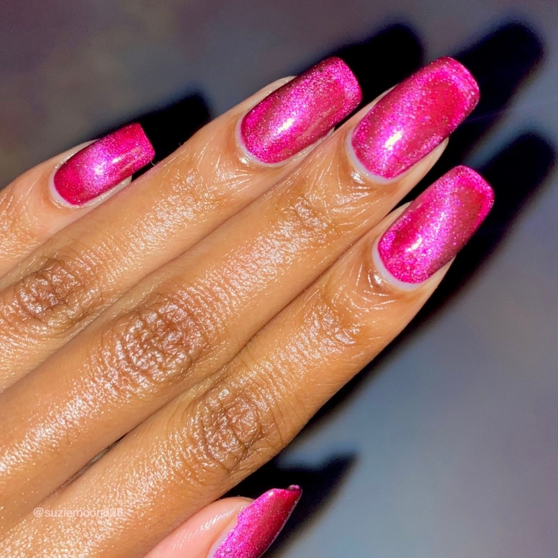 hand shot of bubble gum bitch, a pink and silver vegan nail polish